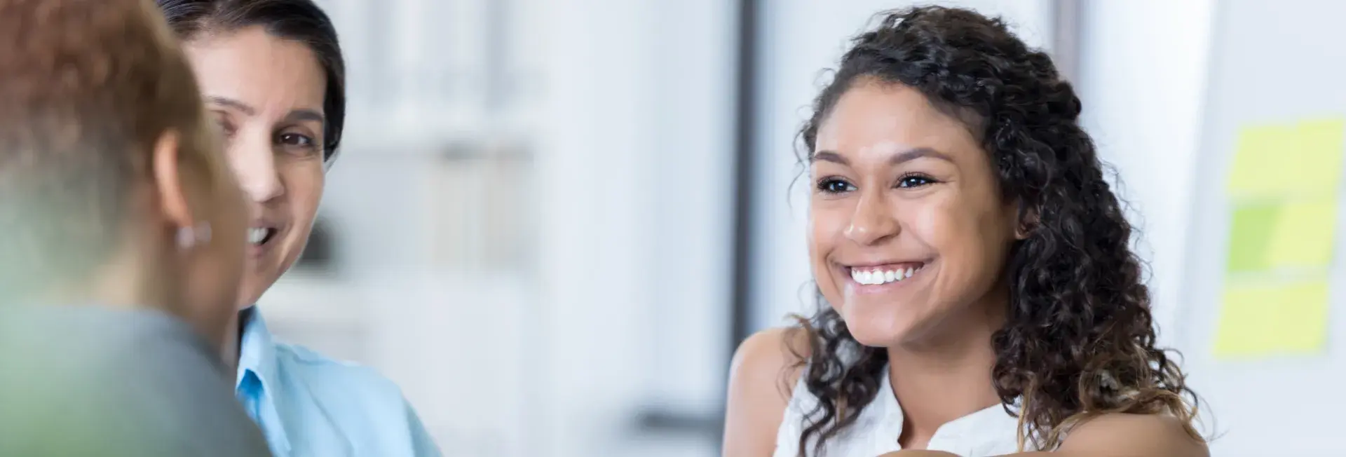 latino woman shaking hands in partnership