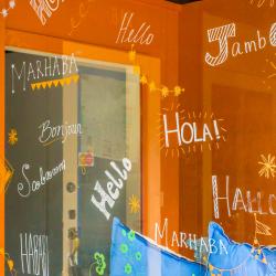 Storefront with hello written in different languages.