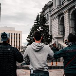 Men in front of CO Capitol