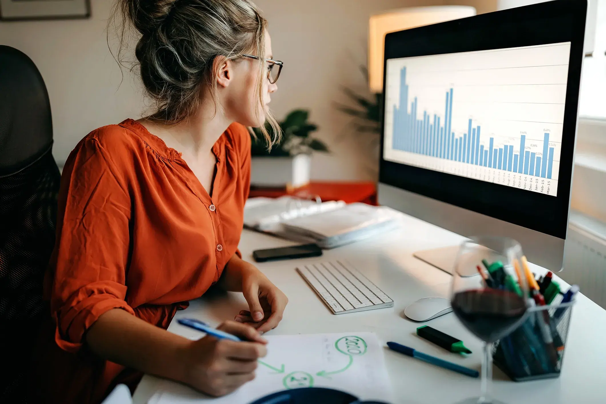 woman looking at data on the computer