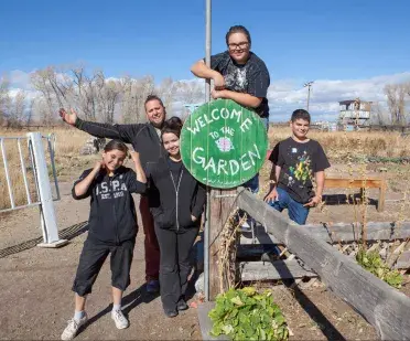 Picture of people standing in a community garden