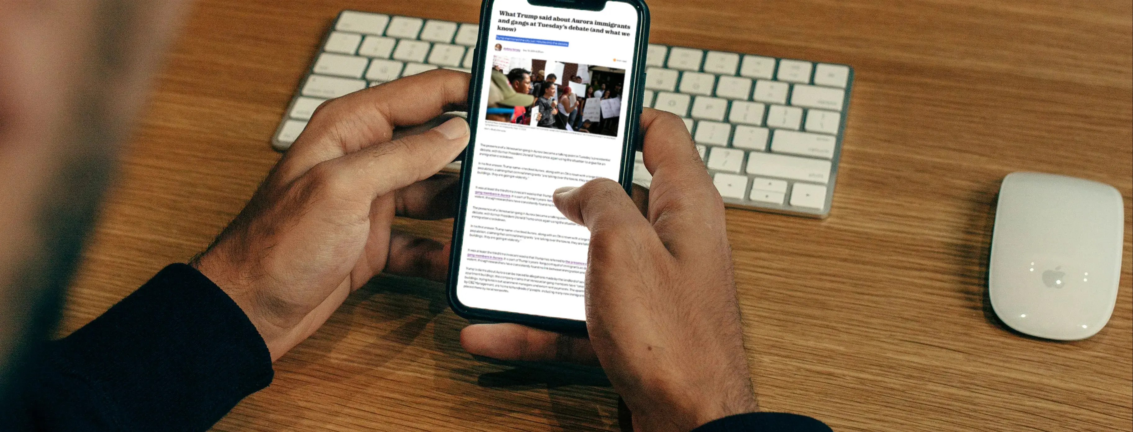 A man reading news on his phone