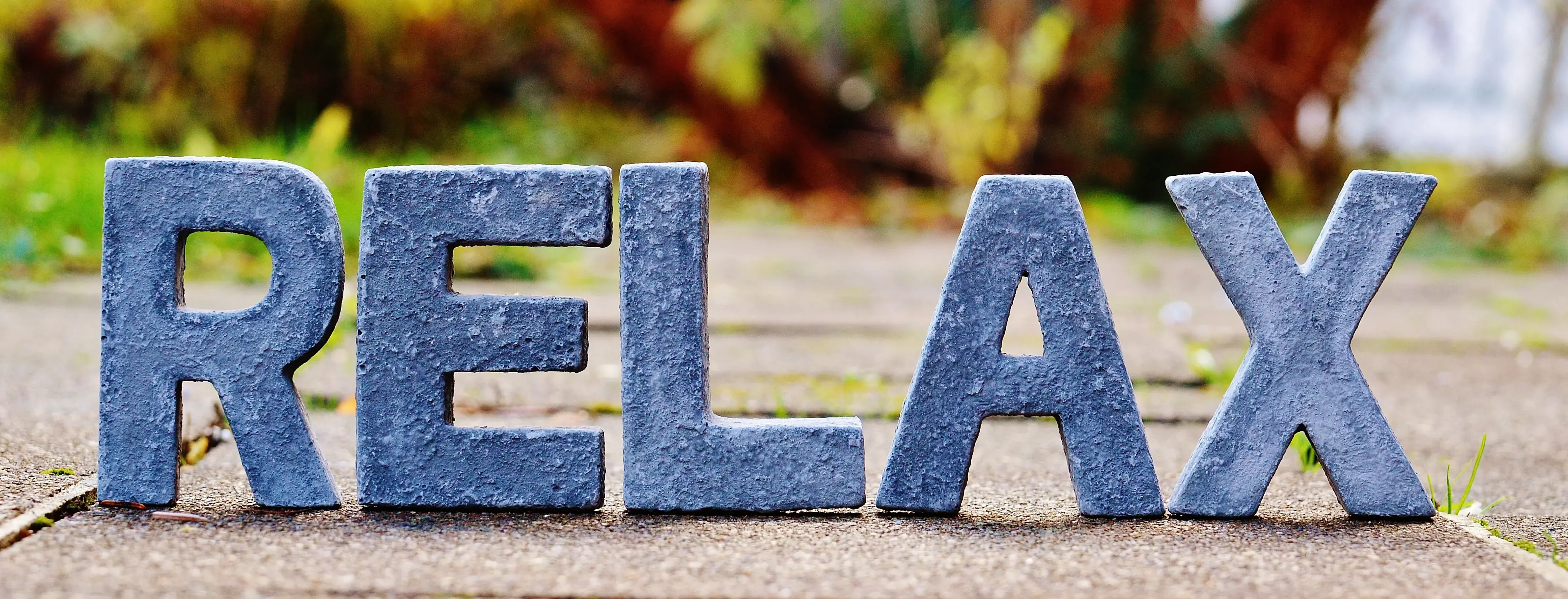 the word relax set against a natural background